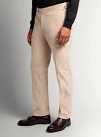 Sand beige babycord trousers shown full length