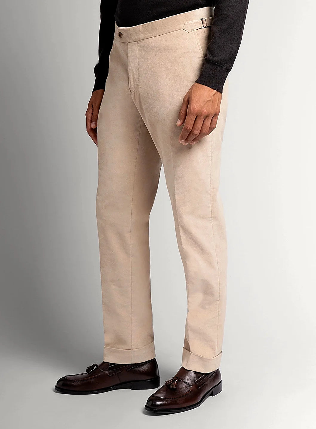 Sand beige babycord trousers shown full length