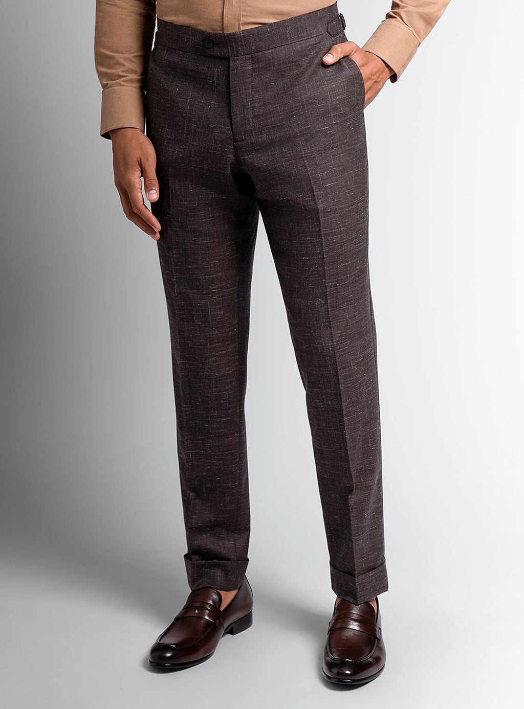 Waistband and side adjuster detail of the trousers