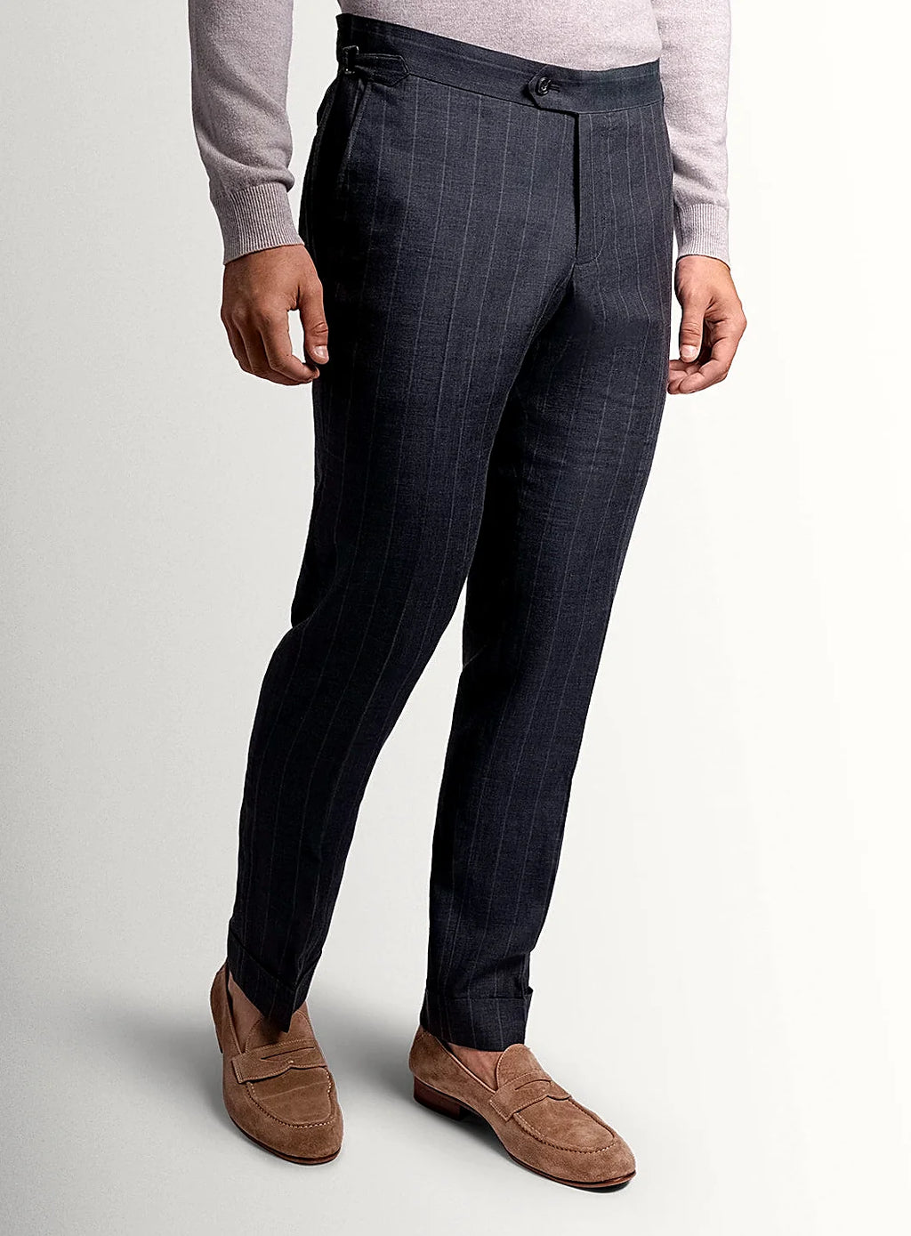 Olive pinstripe trousers shown full length on a model
