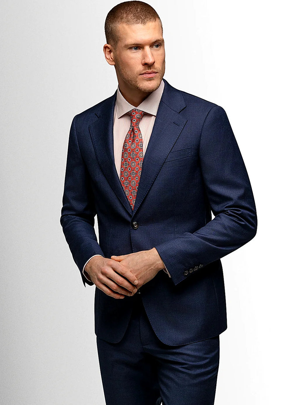 Navy plaid suit worn full length with a shirt and tie