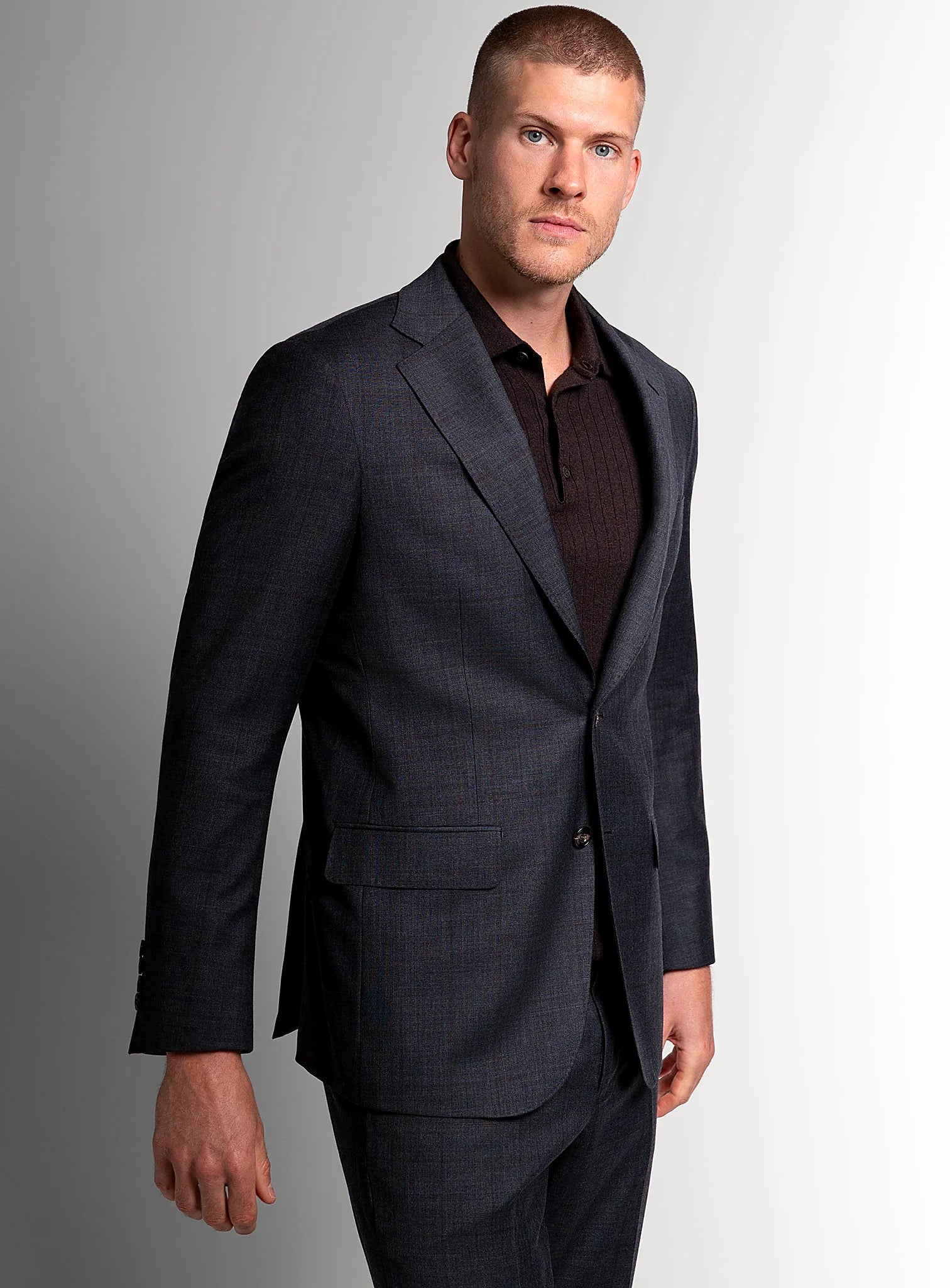 Close view of the cherry overcheck in the charcoal cloth