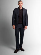 Three-quarter view of the charcoal jacket and trousers