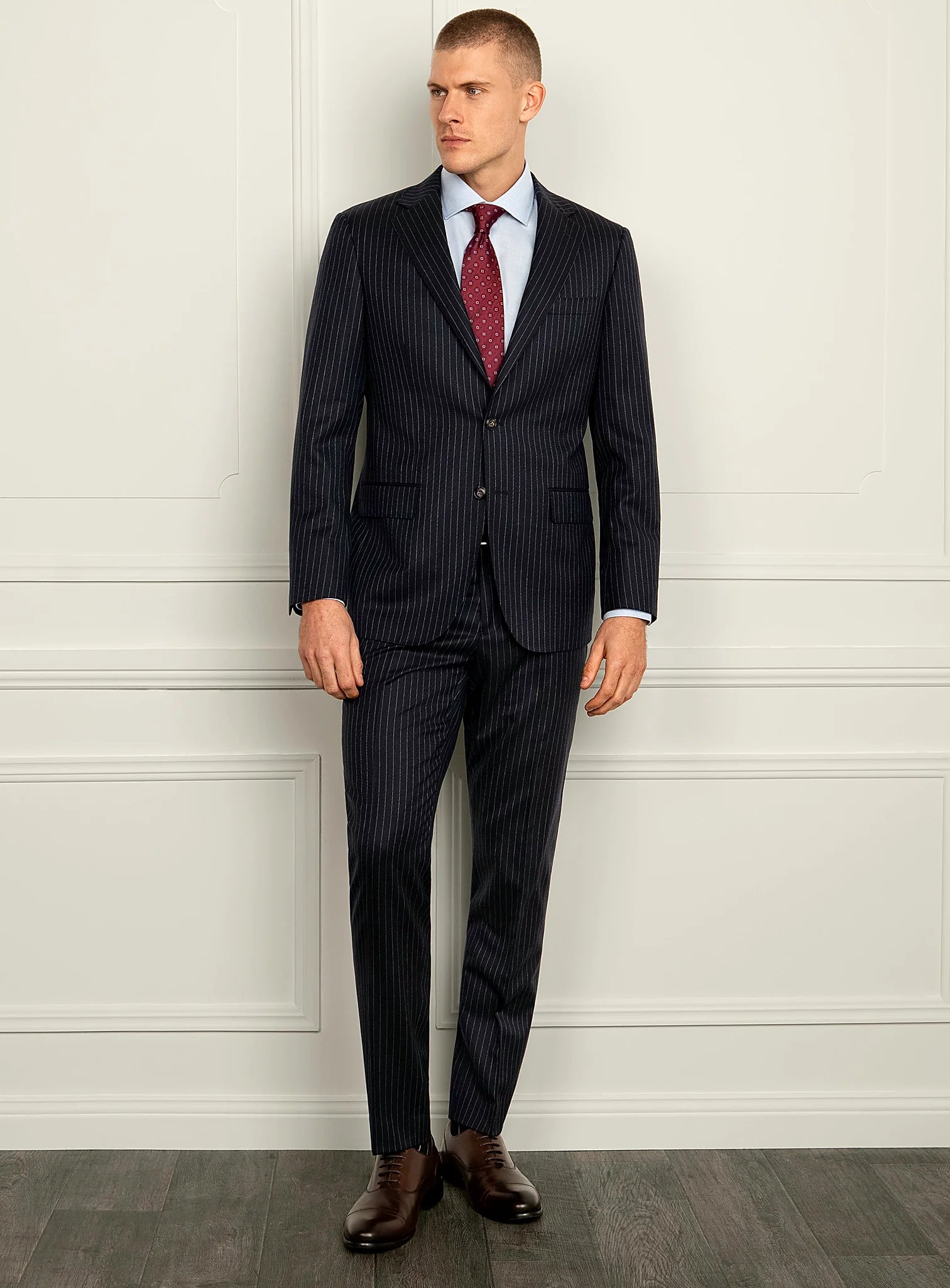 Side angle of the pinstripe jacket and trousers