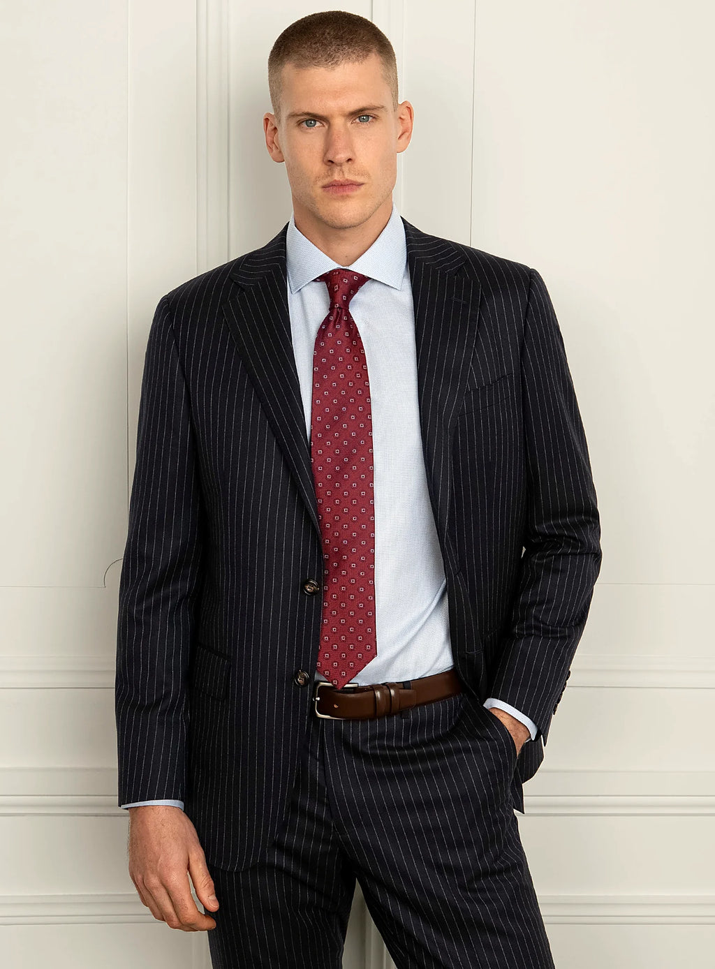 Shoulder and lapel detail of the navy pinstripe jacket