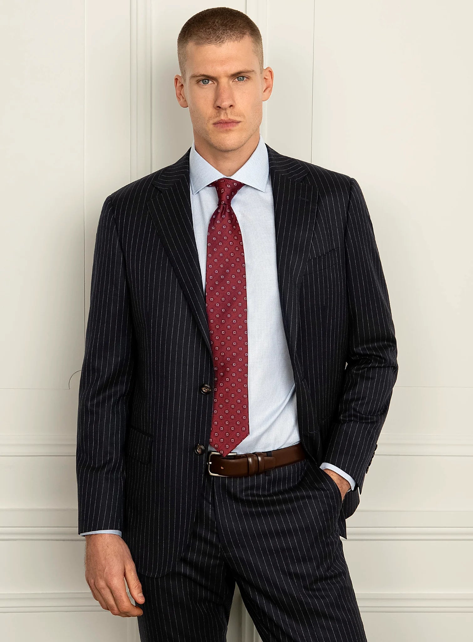 Shoulder and lapel detail of the navy pinstripe jacket