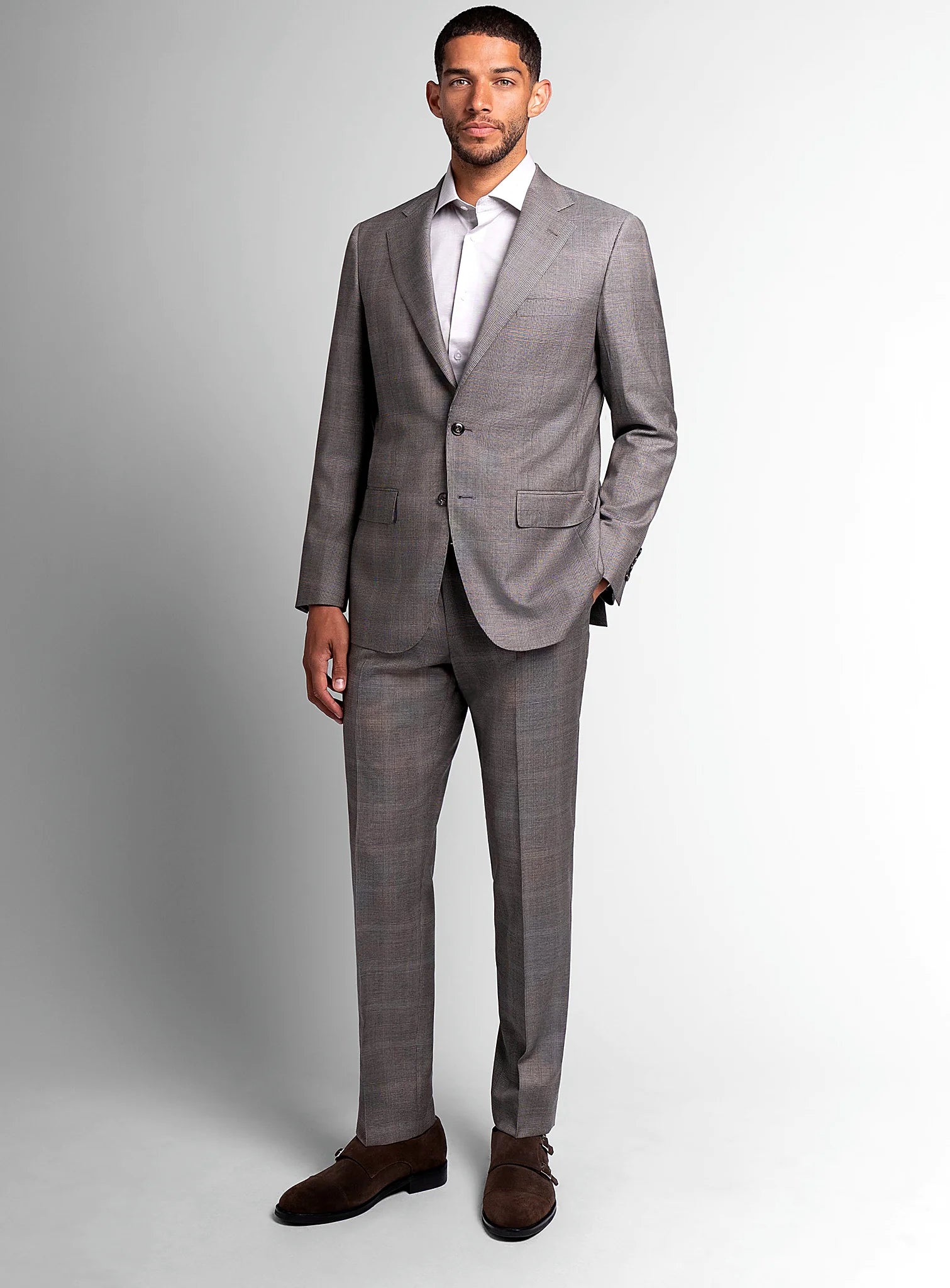 Three-quarter view of the brown jacket and trousers