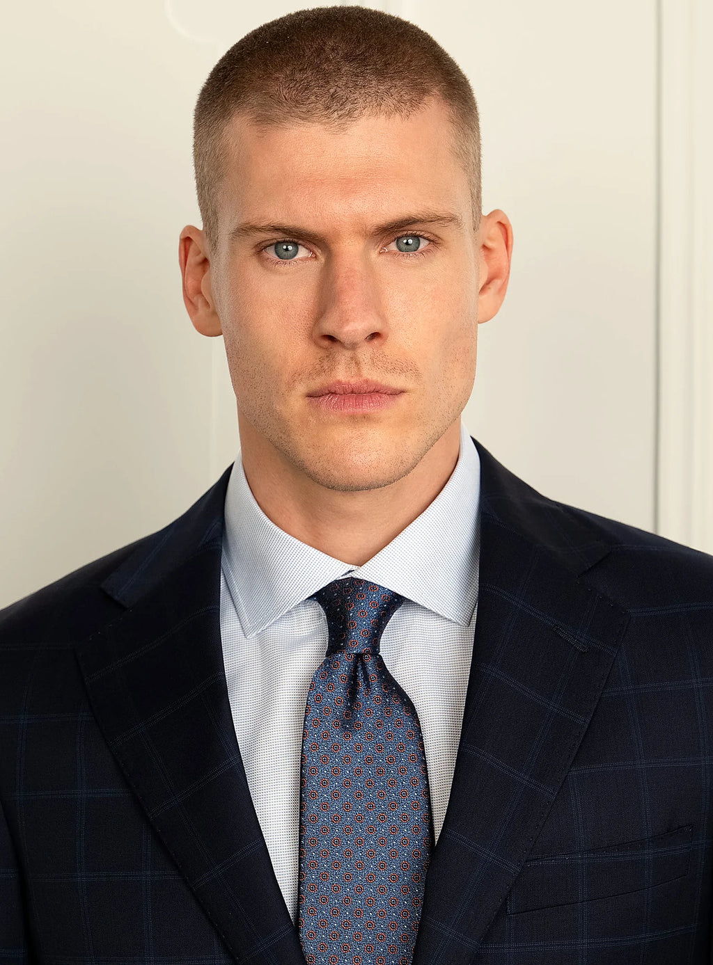 Upper body view showing the notch lapel and buttoning