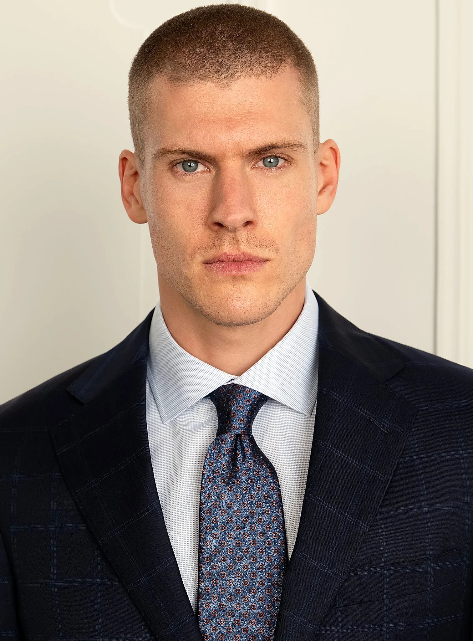 Upper body view showing the notch lapel and buttoning
