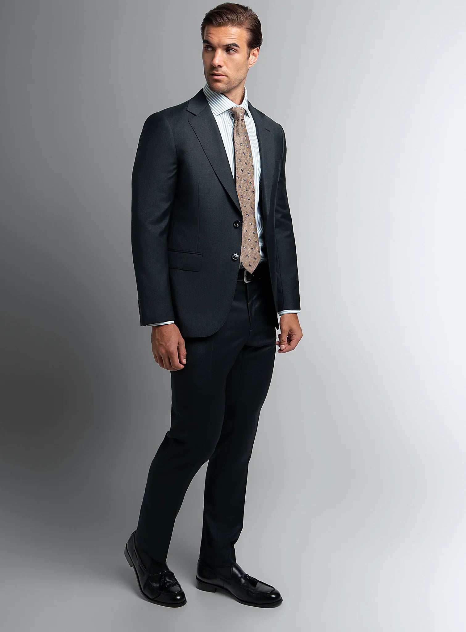 Three-quarter view of the charcoal jacket and trousers