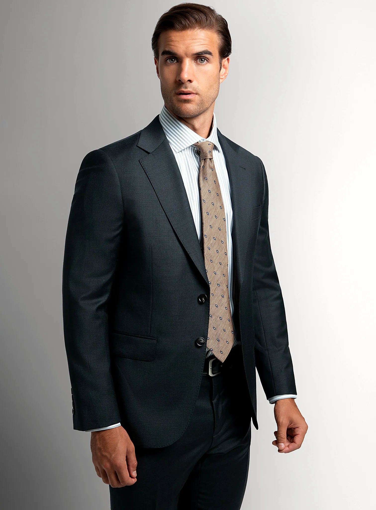 Charcoal twill suit shown full length with a white shirt