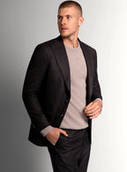Structured peak lapel detail on the brown jacket