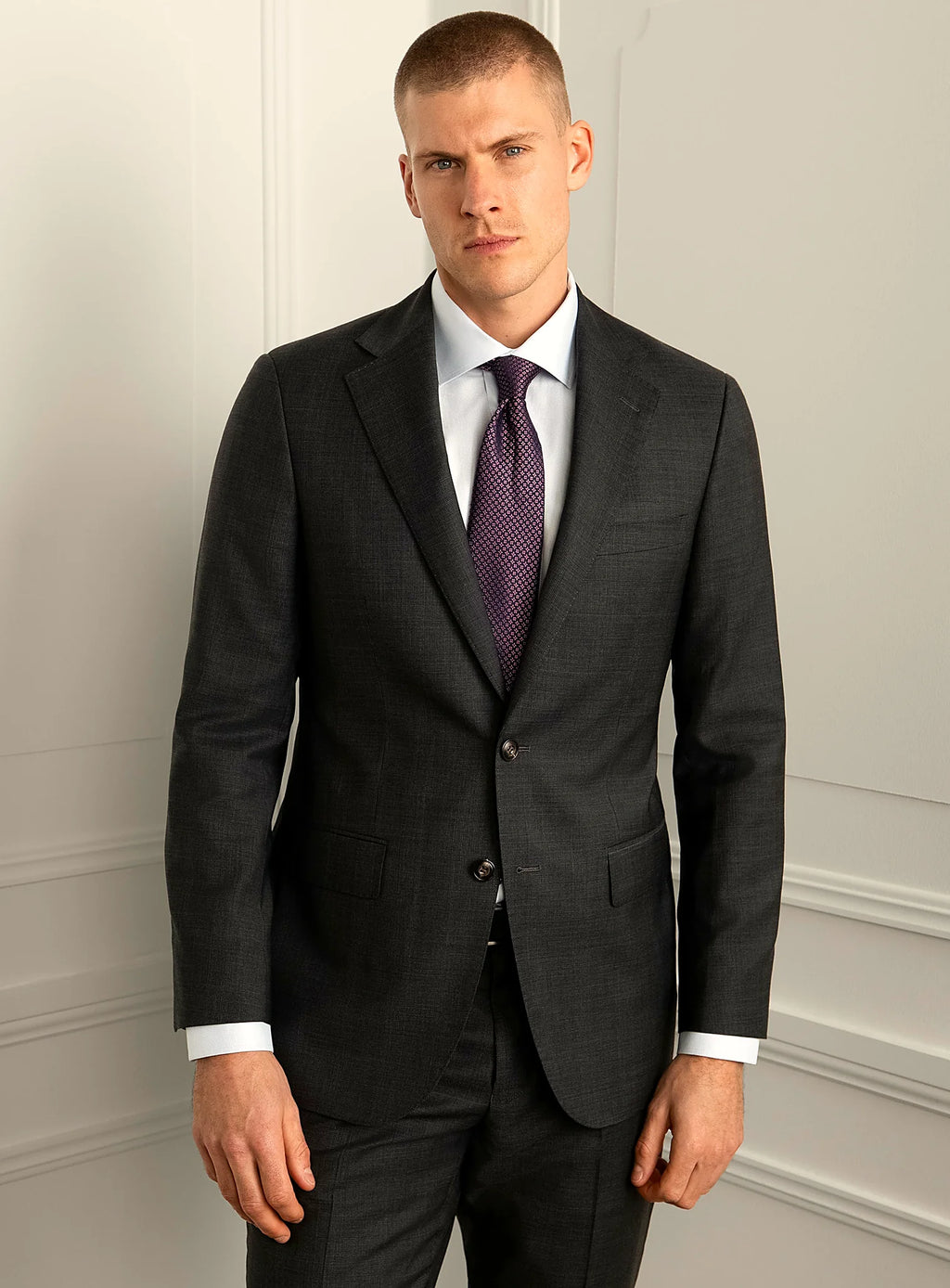 Charcoal plaid suit shown full length with a white shirt and tie