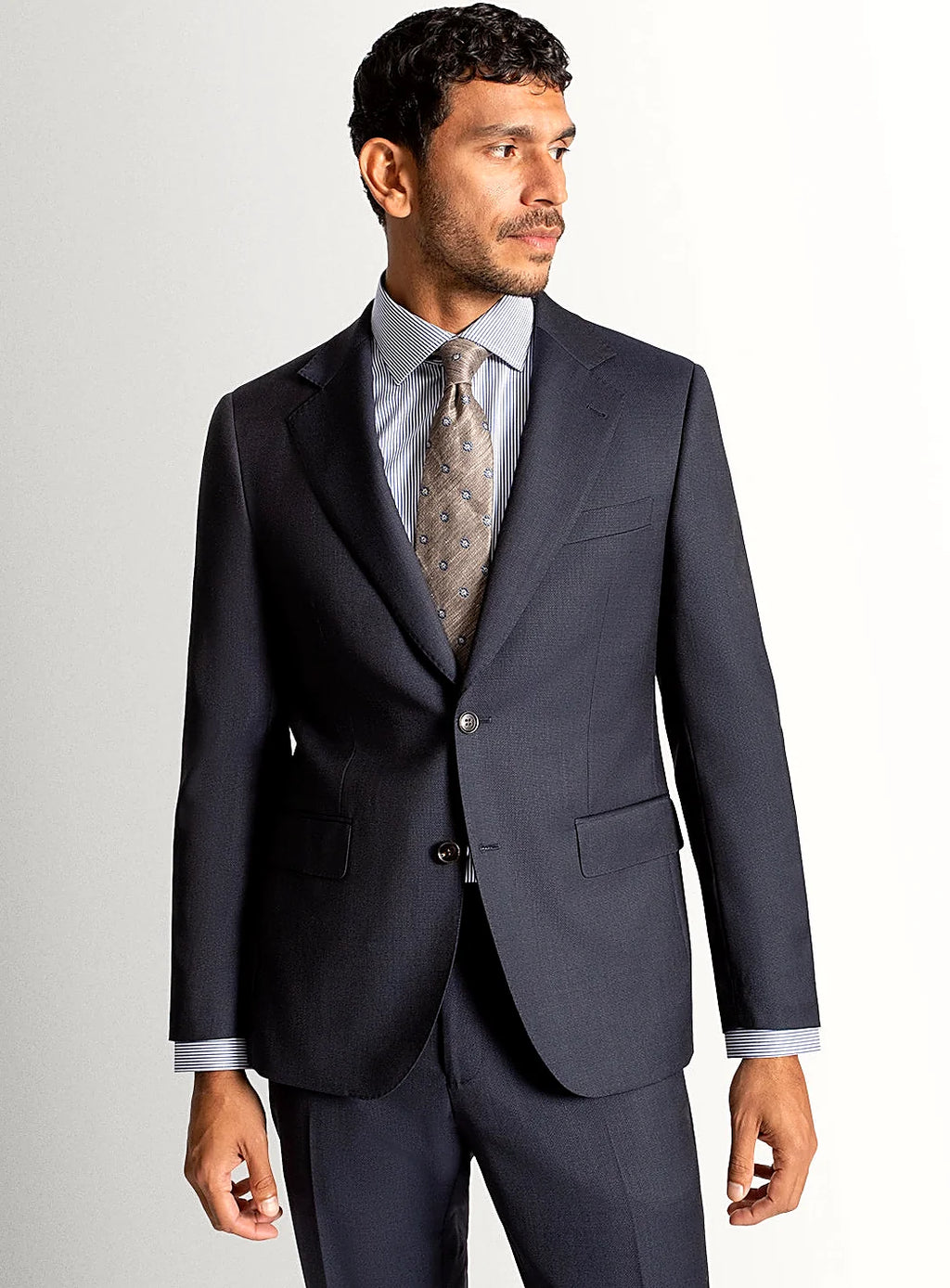Navy basketweave suit shown full length with a pale shirt