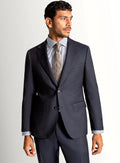 Navy basketweave suit shown full length with a pale shirt