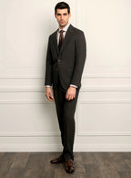 Three-quarter view of the brown jacket and trousers