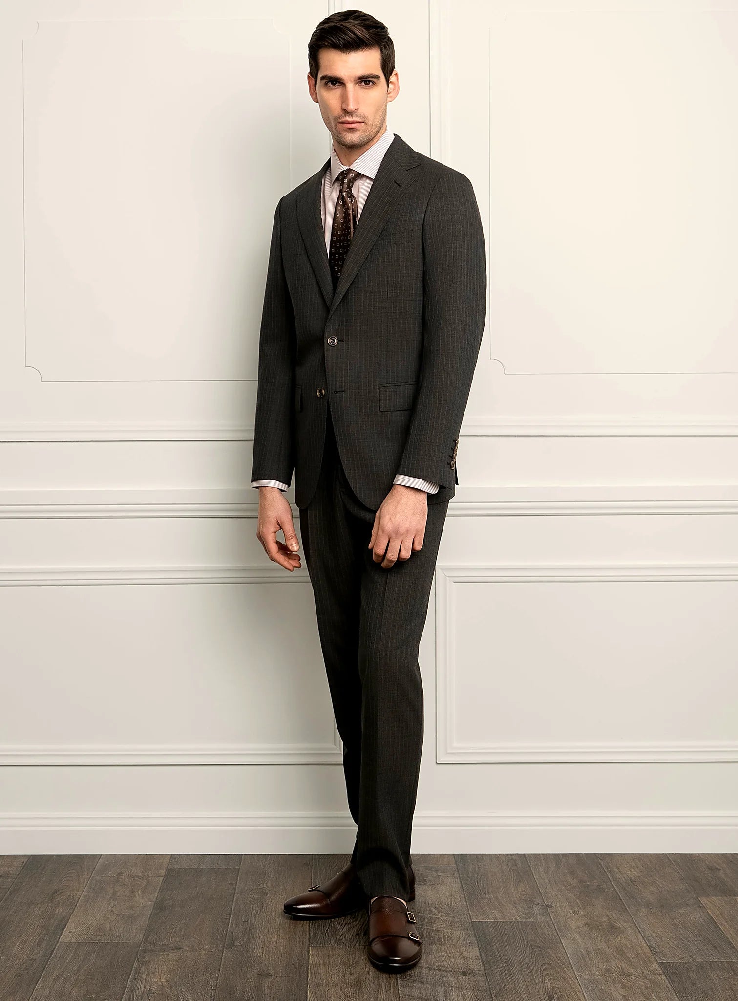 Three-quarter view of the brown jacket and trousers