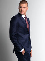 Shoulder and lapel detail of the navy jacket
