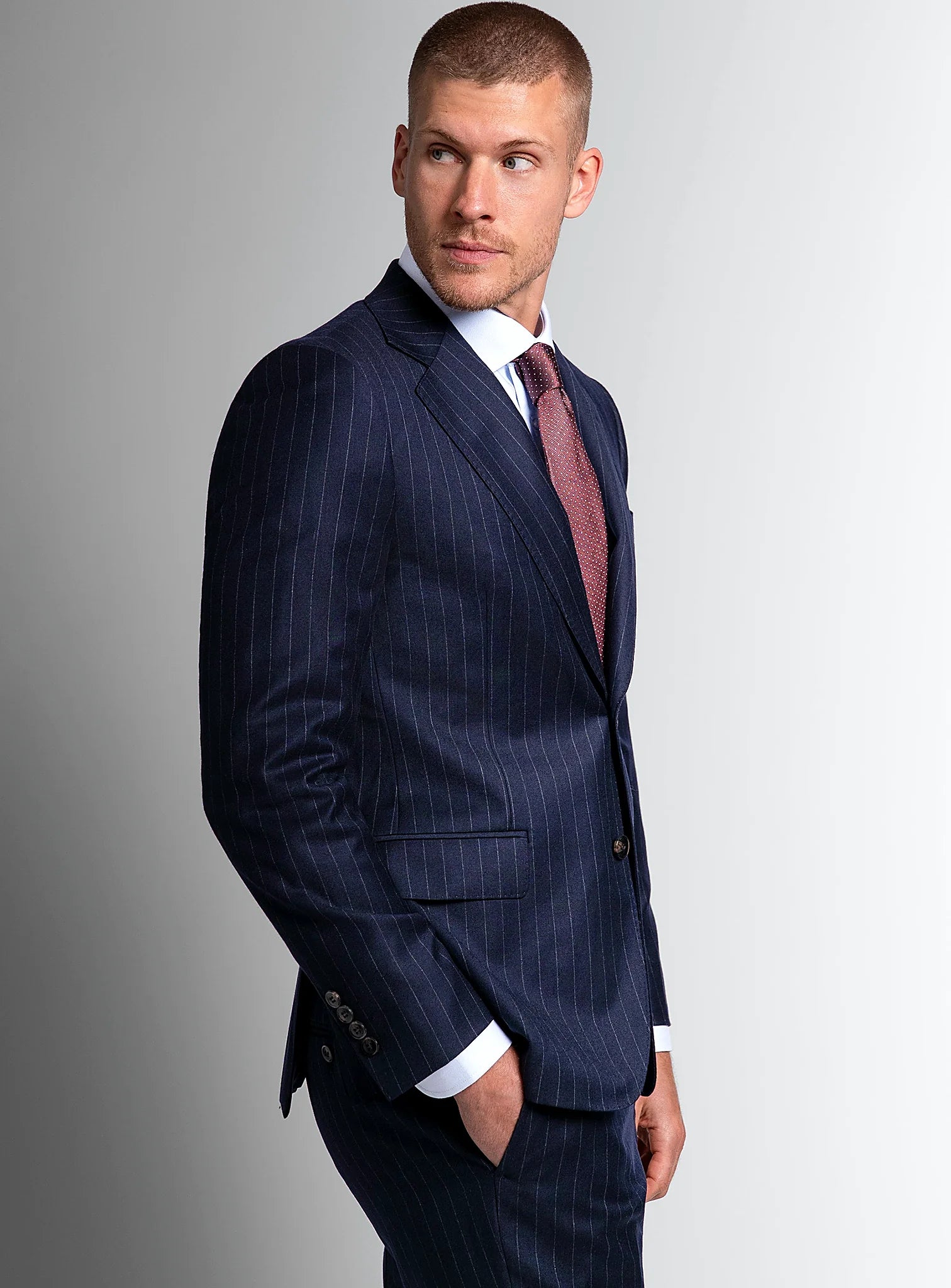 Shoulder and lapel detail of the navy jacket