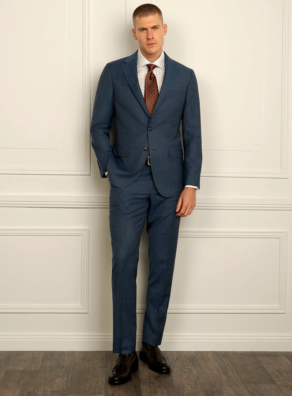 Angled view of the blue jacket and matching trousers