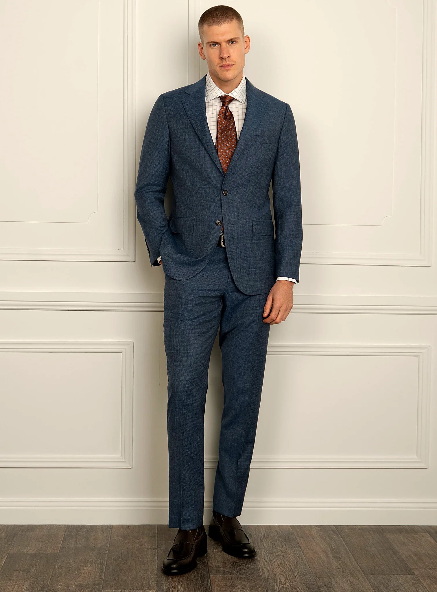 Angled view of the blue jacket and matching trousers