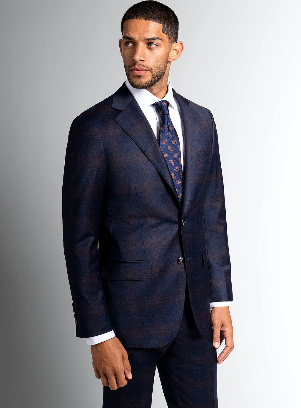 Navy bronze plaid suit worn full length on a model