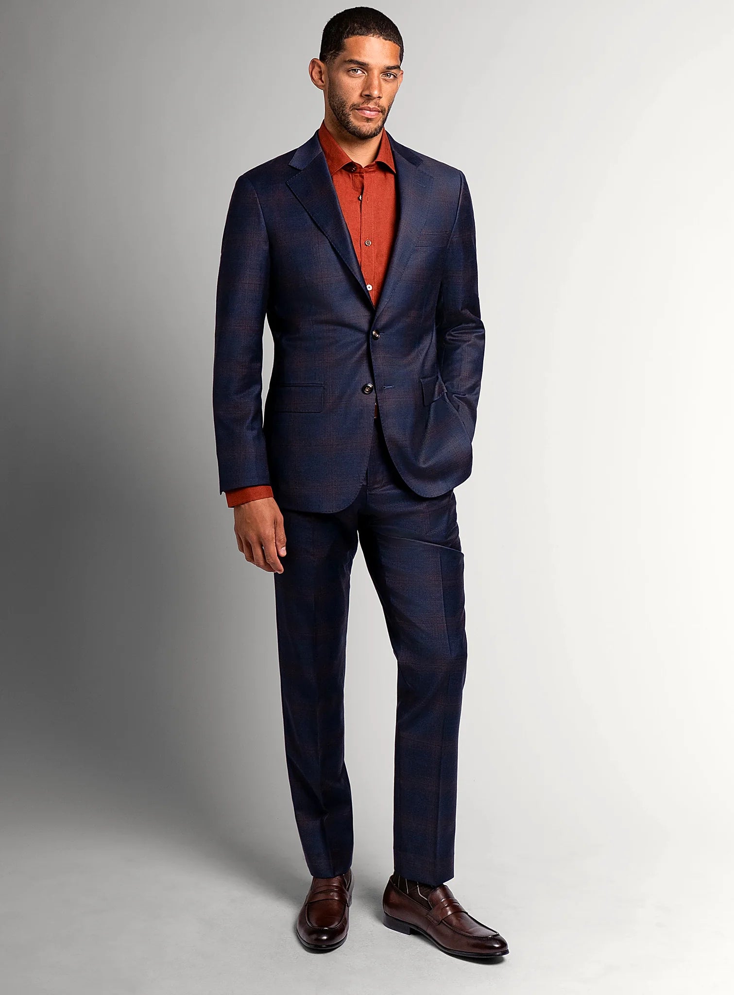 Lapel and flap pocket detail of the navy jacket