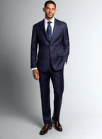 Angled view of the navy jacket and matching trousers