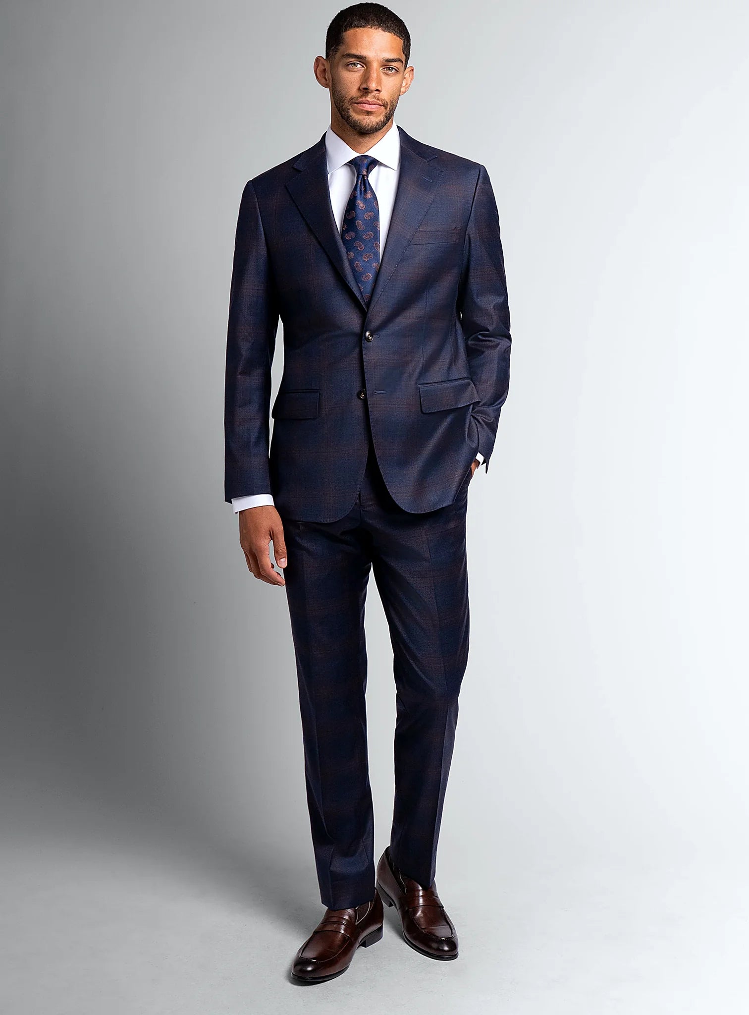 Angled view of the navy jacket and matching trousers