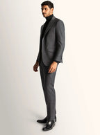 Three-quarter view of the grey jacket and trousers