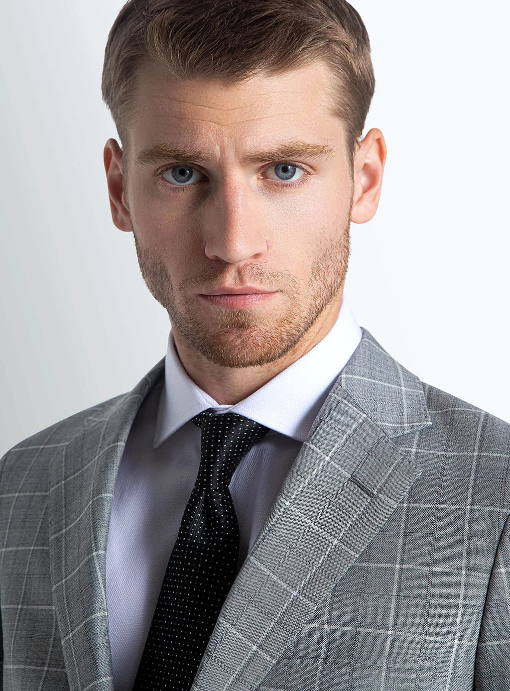 Close view of the plaid across the grey cloth
