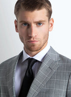 Close view of the plaid across the grey cloth