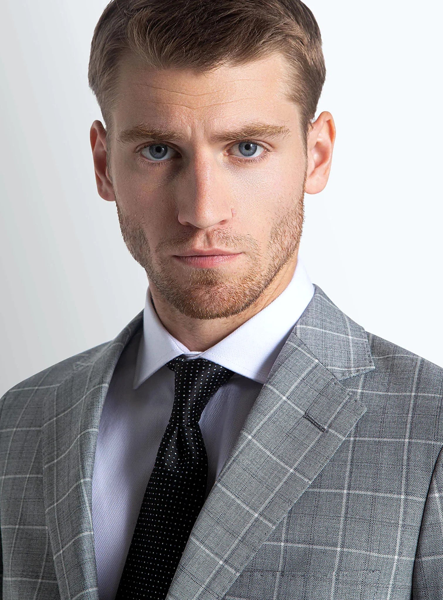 Close view of the plaid across the grey cloth