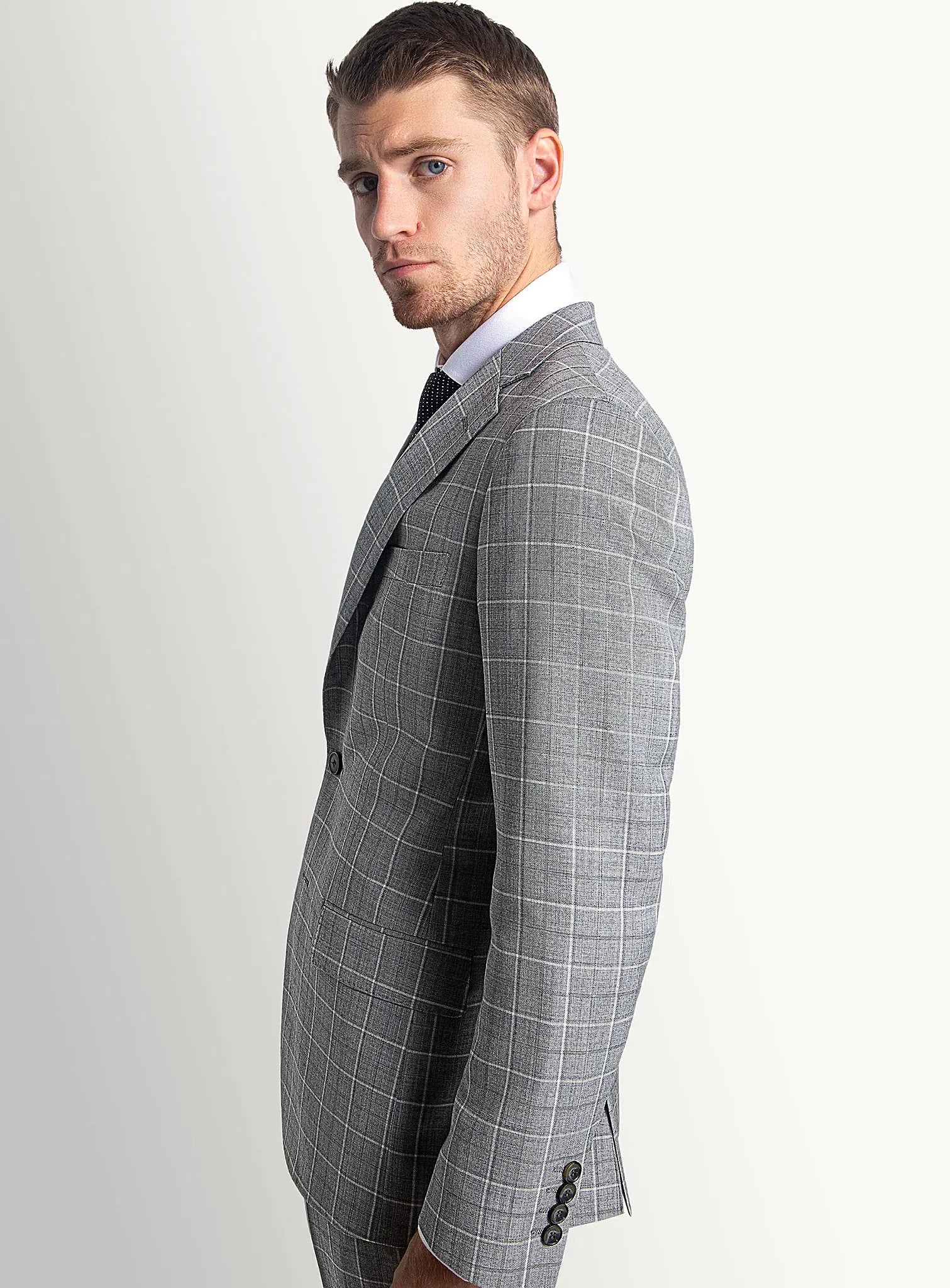 Collar and lapel detail of the grey suit jacket