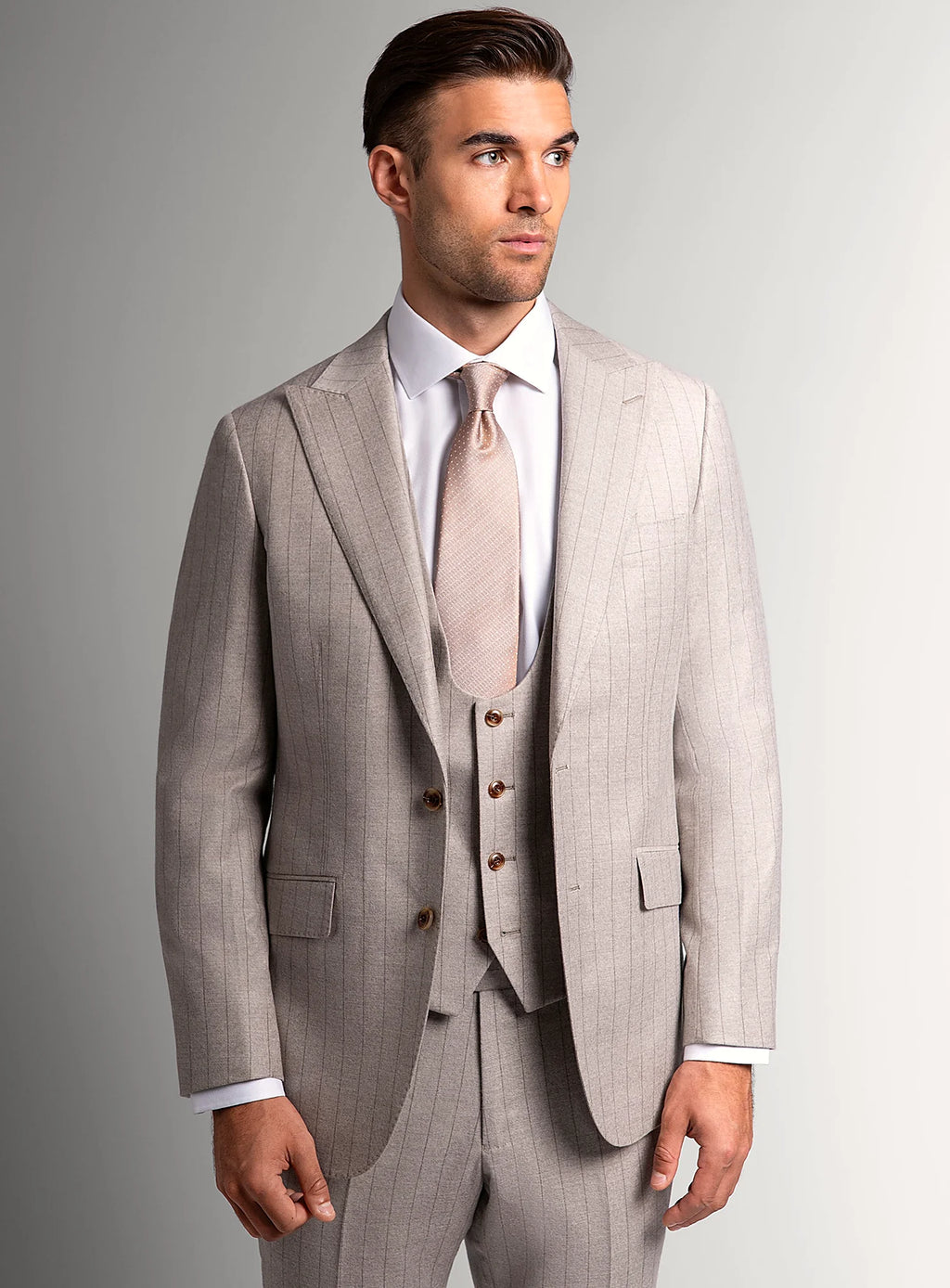 Taupe flannel suit shown full length with a pale shirt