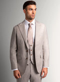 Taupe flannel suit shown full length with a pale shirt