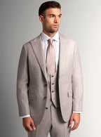 Taupe flannel suit shown full length with a pale shirt