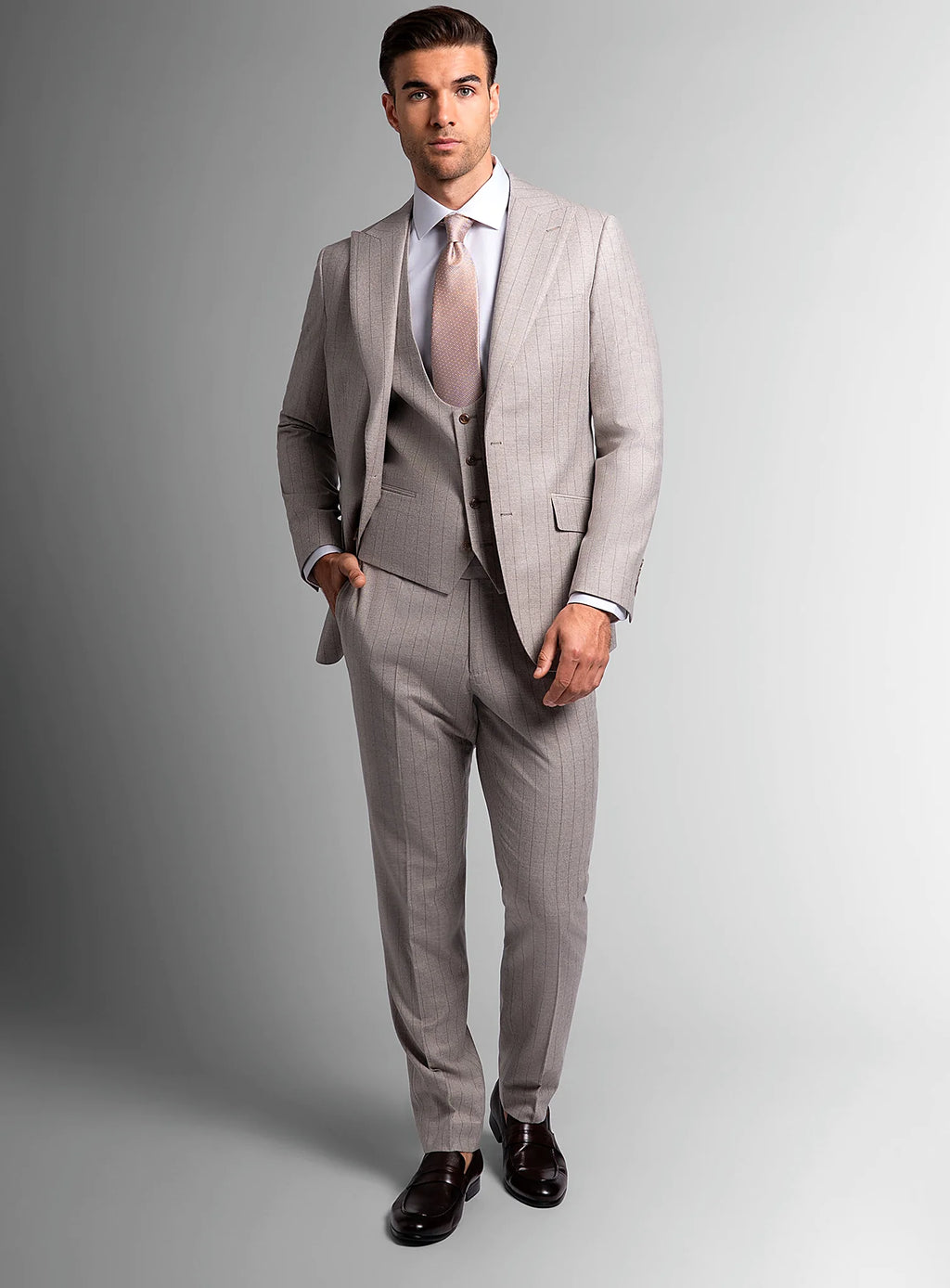 Angled view of the taupe jacket and matching trousers