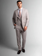 Angled view of the taupe jacket and matching trousers