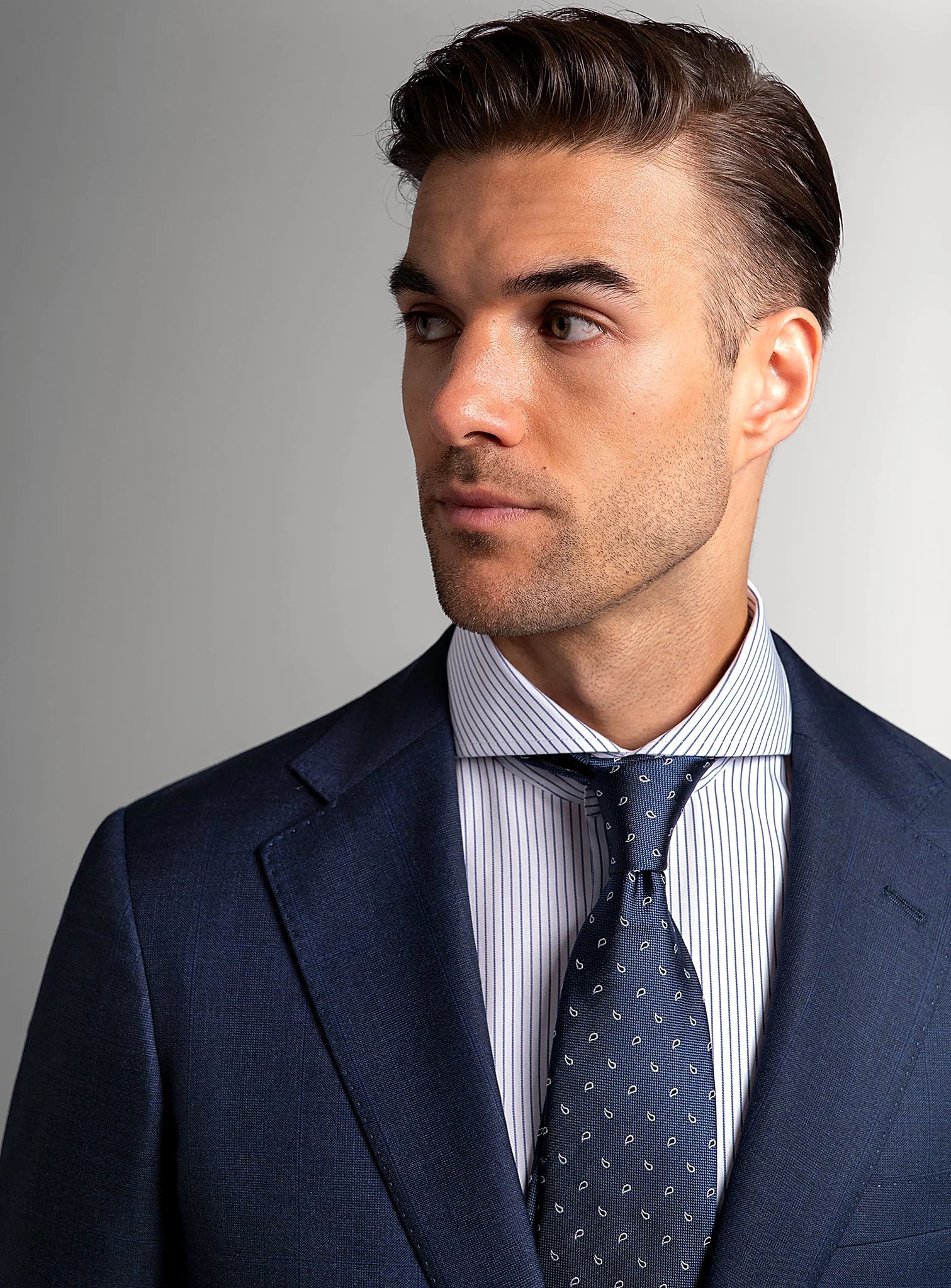 Close view of the subtle plaid across the navy cloth