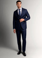 Three-quarter view of the navy jacket and trousers