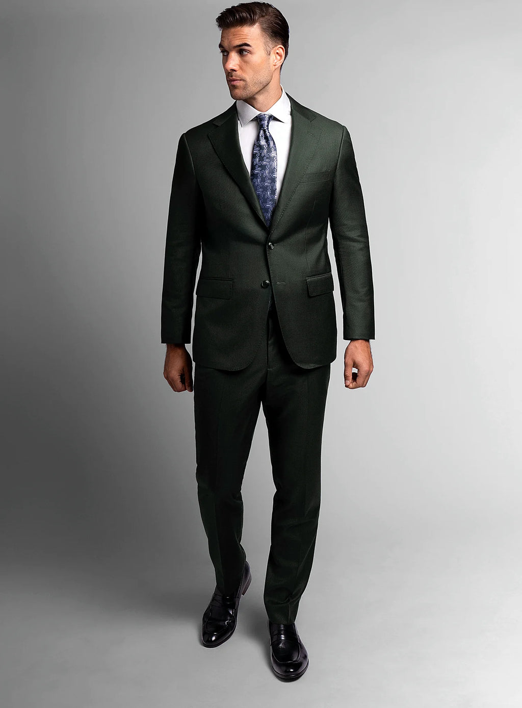 Angled view of the green jacket and matching trousers