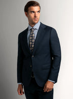 Navy basketweave suit worn full length with a white shirt