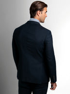 Lapel and chest pocket detail of the navy jacket