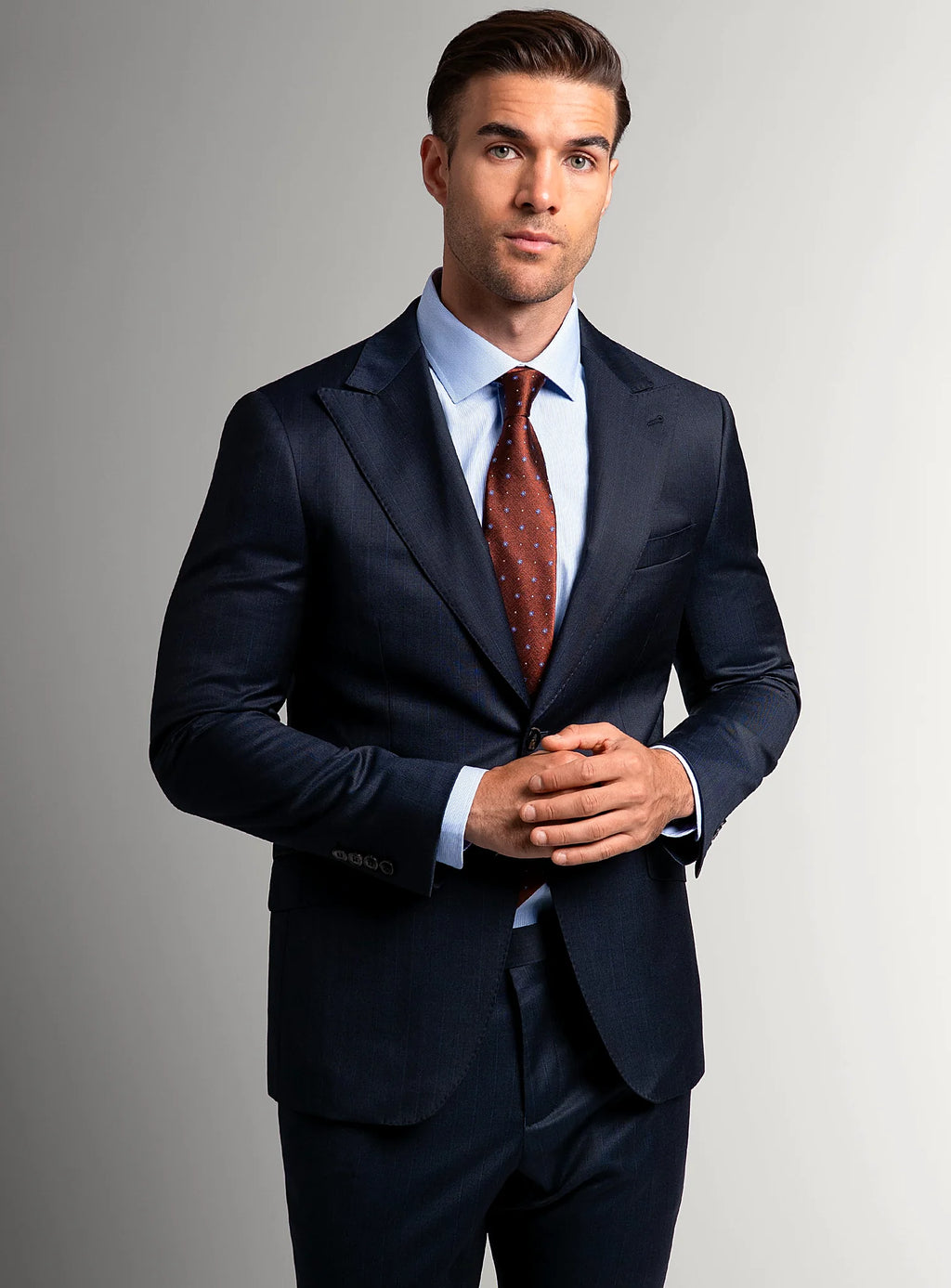 Peak lapel detail on the navy suit jacket