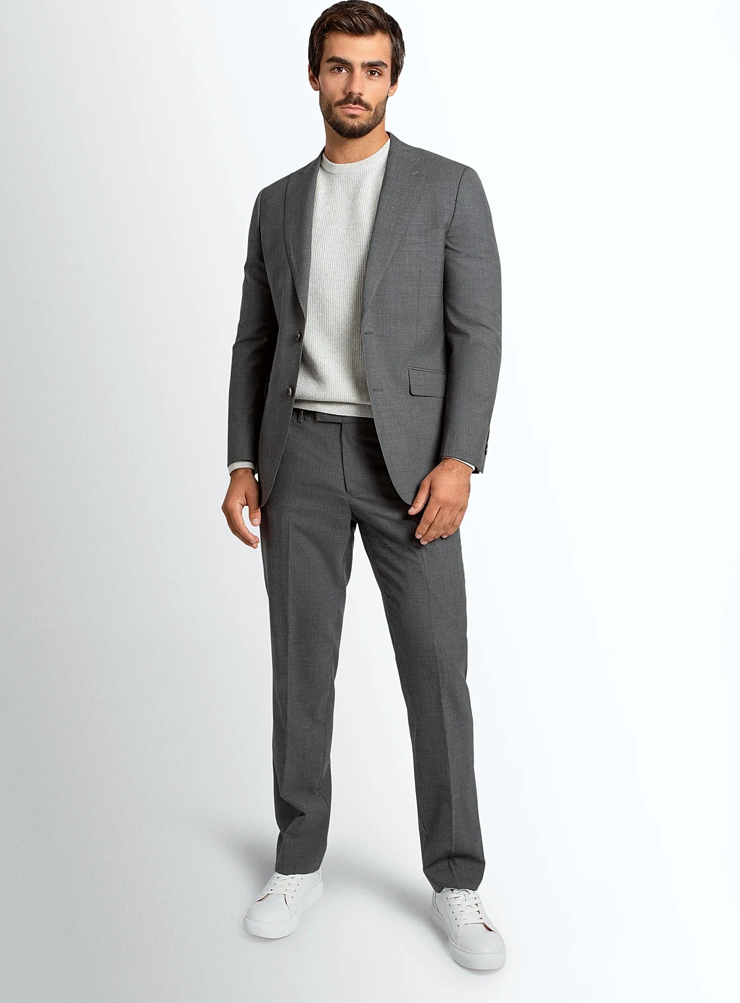 Rear view showing the dual vents on the grey jacket