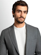 Notch lapel and pocket square detail on the grey jacket