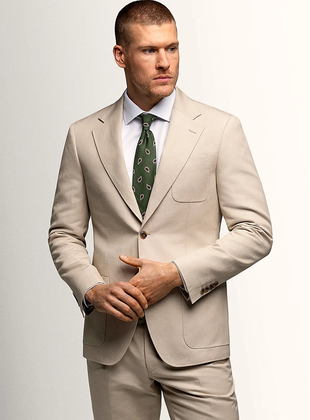 Taupe canvas jacket worn open over a plain shirt