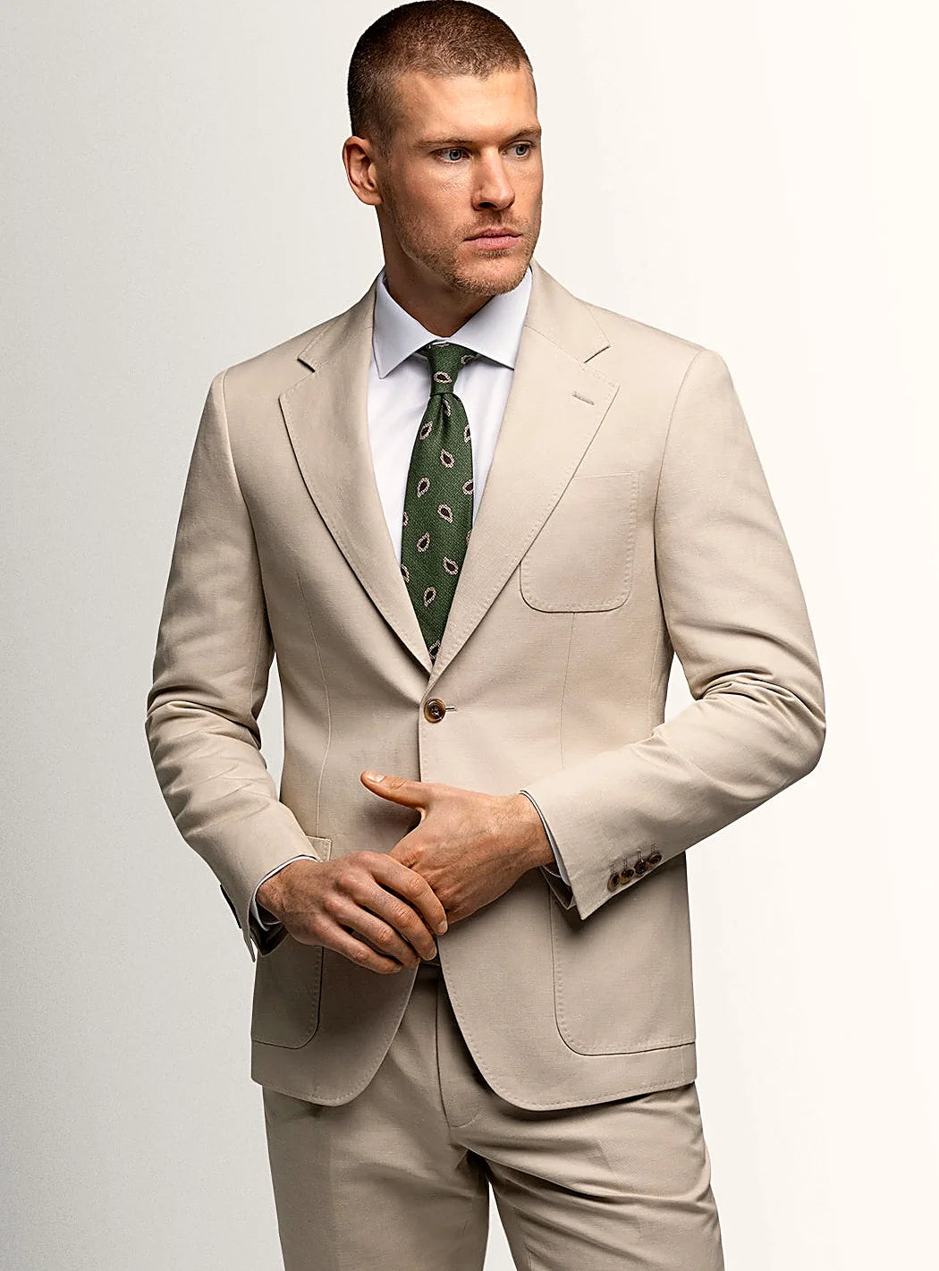 Taupe canvas jacket worn open over a plain shirt
