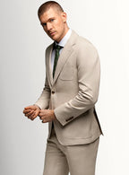 Patch pocket and notch lapel detail on the taupe jacket